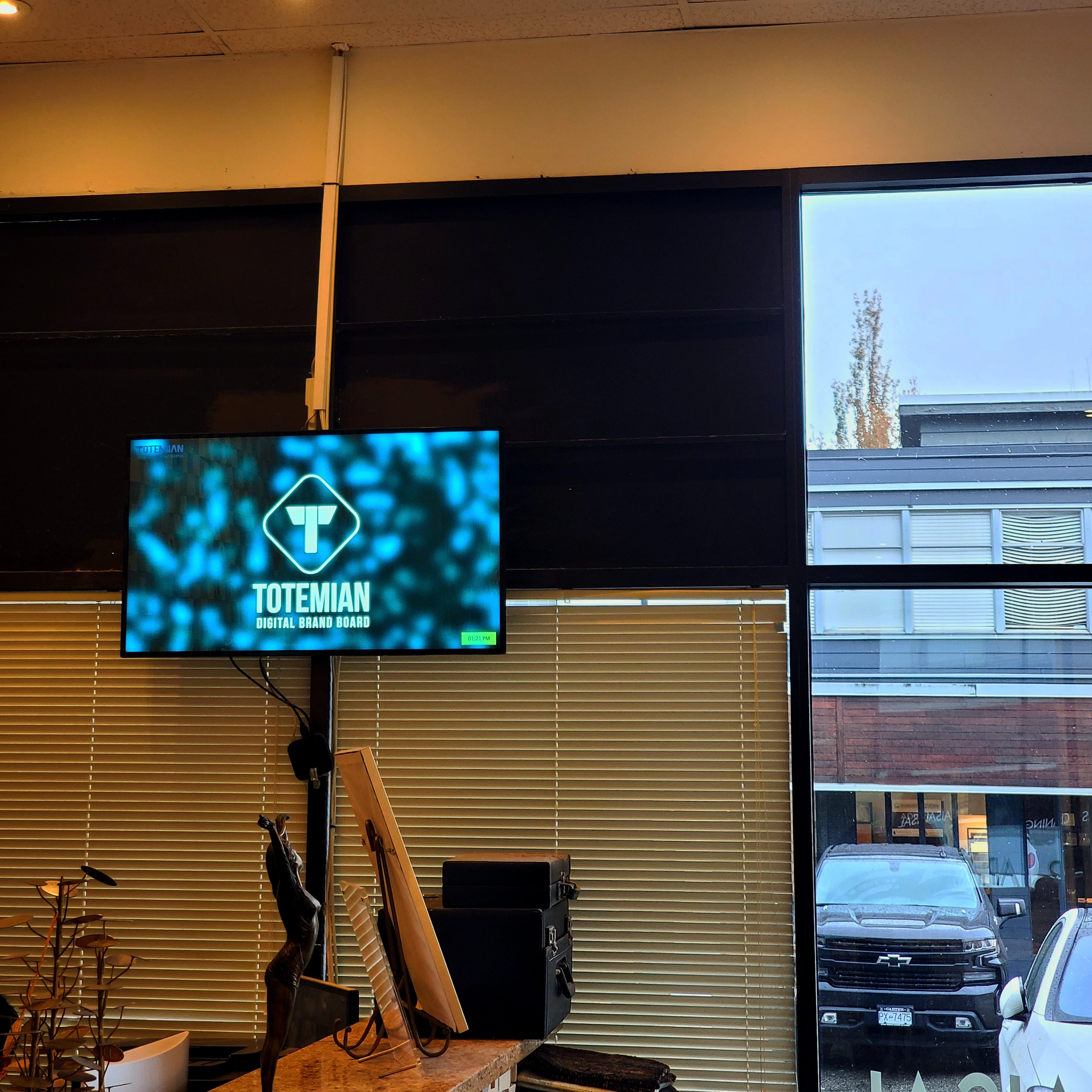 A horizontal screen showing the Totemian Digital Brand Board logo