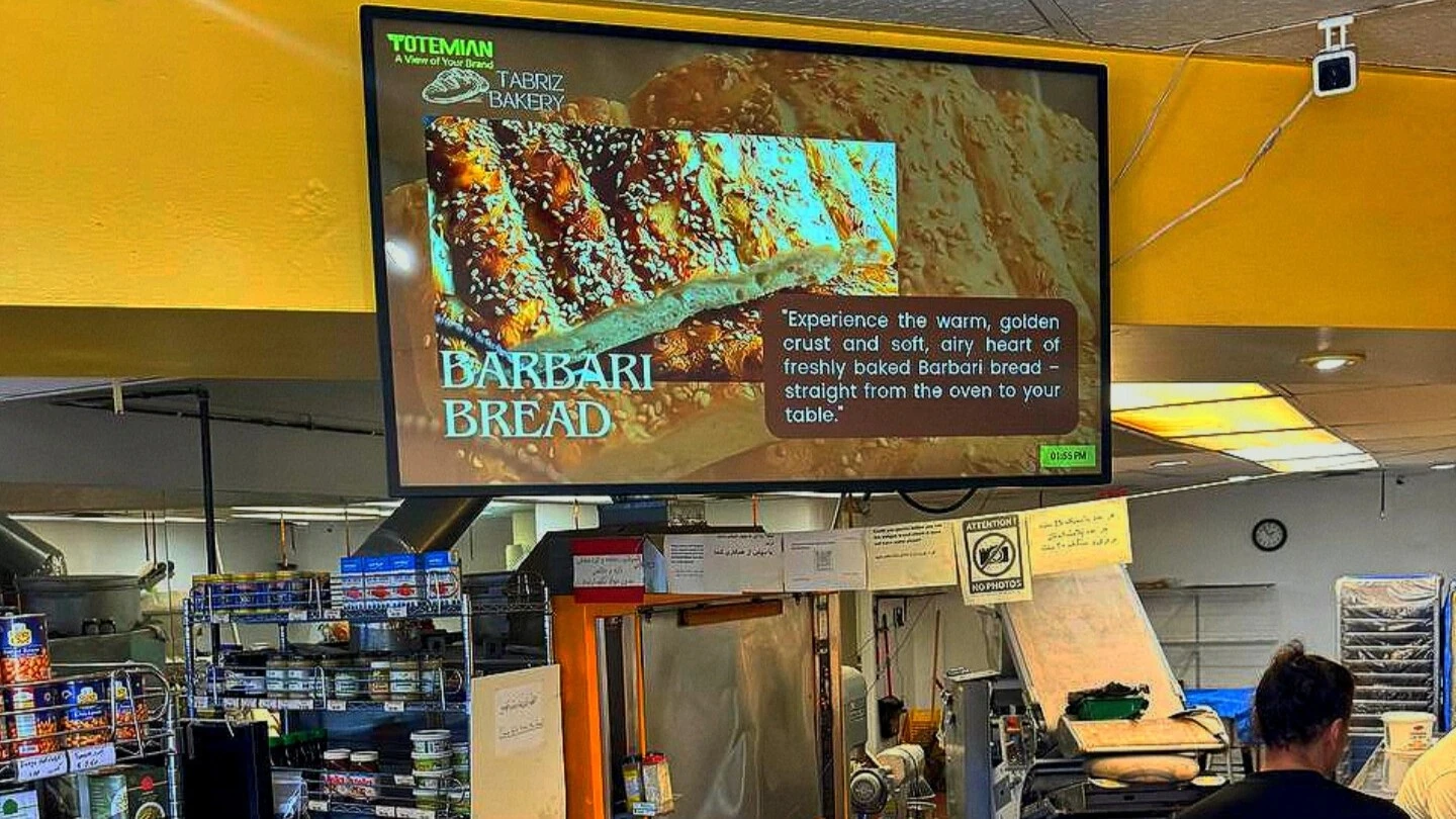 The screen features an advertisement for TABRIZ BAKERY and their BARBARI BREAD